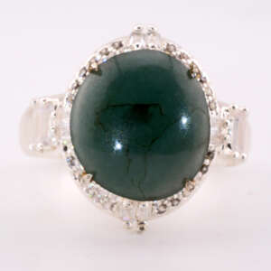 Front-facing view of the jadeite ring showing the large oval bluish-green cabochon and symmetric halo of small white accent stones